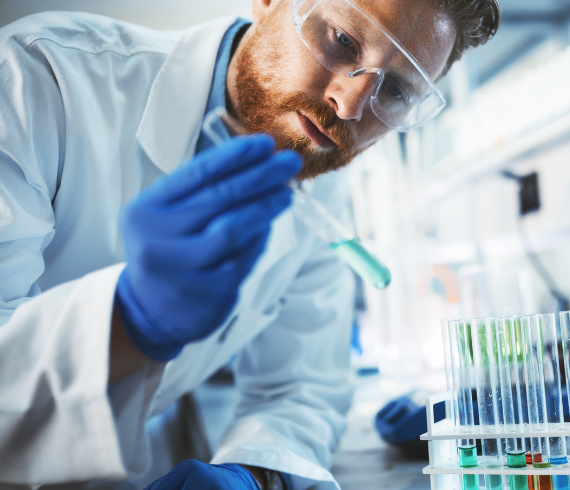 Rosemont Pharmaceuticals - Man using test tubes in a laboratory