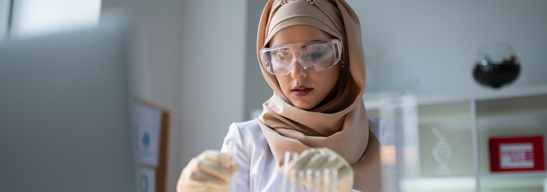 Rosemont Pharmaceuticals - Lady in headscarf working in a lab