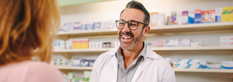 Rosemont Pharmaceuticals - Pharmacist smiling at customer
