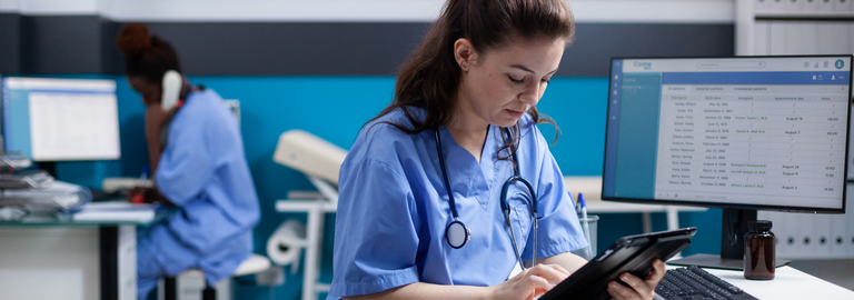 Rosemont Pharmaceuticals - Female doctor accessing information on her tablet