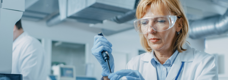 Rosemont Pharmaceuticals - Lady in lab coat using test tubes