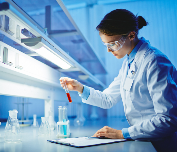 Rosemont Pharmaceuticals - Lady using a test tube in a laboratory