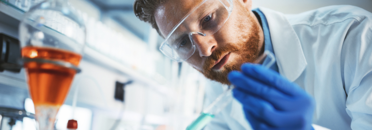 Rosemont Pharmaceuticals - Man using a test tube in a laboratory