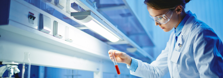 Rosemont Pharmaceuticals - Lady using a test tube in a laboratory