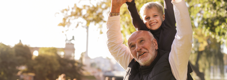 Rosemont Pharmaceuticals - Elderly man smiling with child on shoulders, who is also smiling